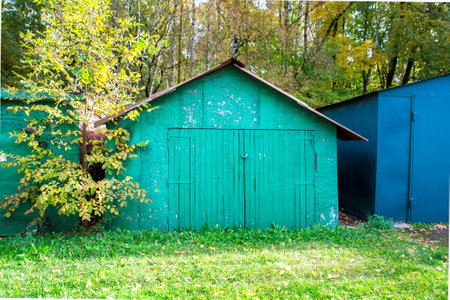 Front view of old wooden green garageの写真素材