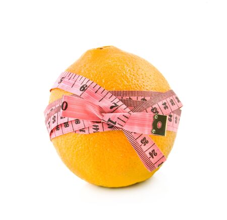 orange is tied around by a centimetre ribbon with a bowの写真素材