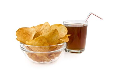 chips in a dish on a background glass with drink isolatedの写真素材