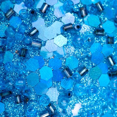 background of the blue beads and sequinsの写真素材