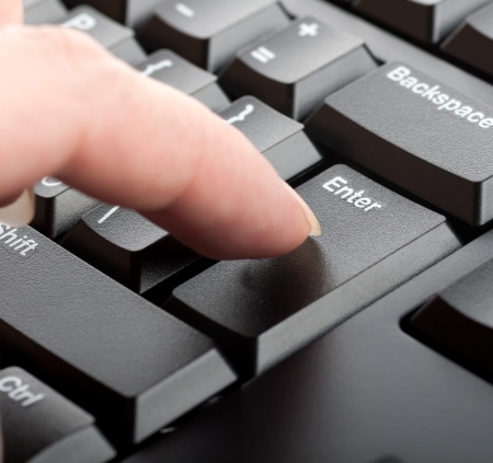 finger women presses a key on the keyboard macroの写真素材