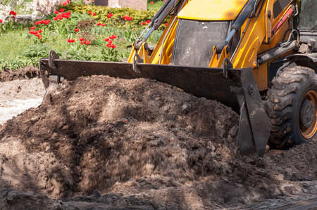 excavator works with the earth closeup