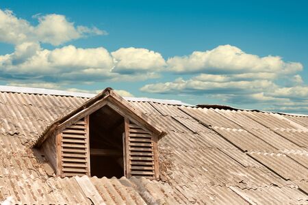 attic window on the roof of the oldの写真素材