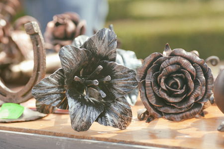 rose flower shaped from iron by a blacksmithの写真素材
