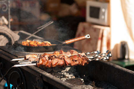 meat on skewers is fried on a grillの写真素材