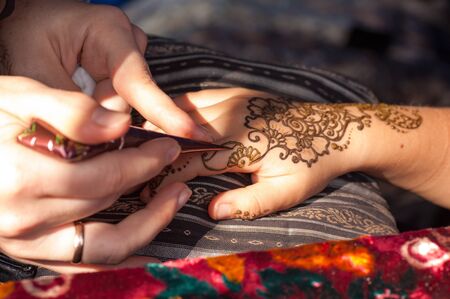 process of drawing mehendi close-upの写真素材