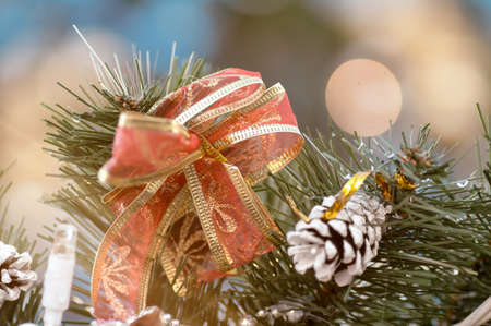 bumps and ornaments on a Christmas tree in the winter on the street, a filter is appliedの写真素材