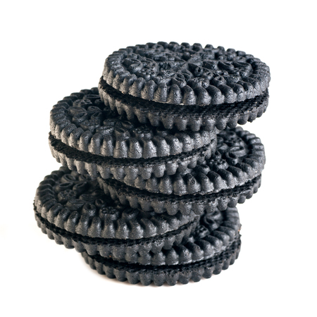 black round biscuits in a pile, isolatedの写真素材