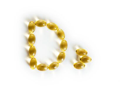 capsules fish oil, vitamin D3 isolated on a white backgroundの写真素材