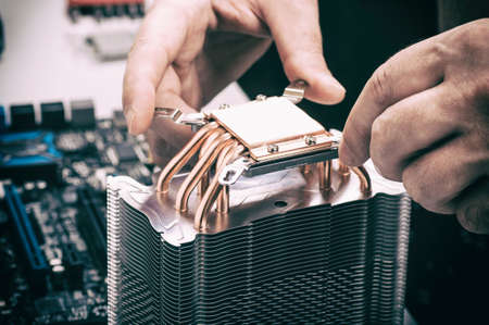 computer repair, the master installs the cooler into the computer