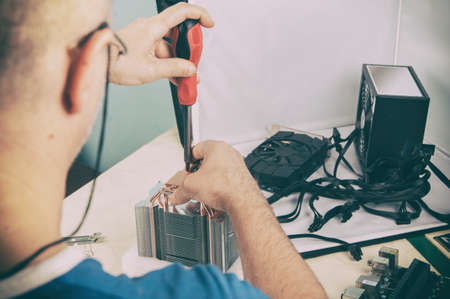 assembling a computer, assembling parts, assembling a cooler for installation in a computer