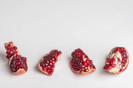 pomegranate slices on gray backgroundの写真素材