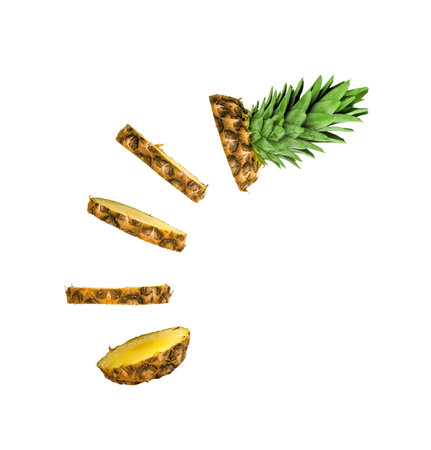 pineapple cut into rings, pineapple rings falling from top to bottom isolated on whiteの写真素材