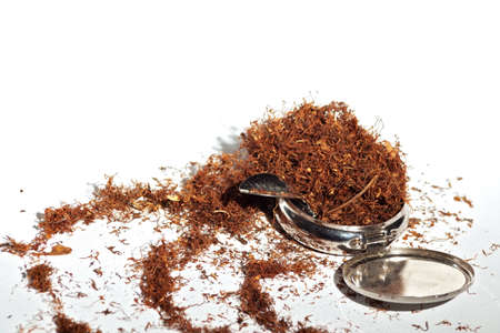 Hand rolling tobacco and filters texture on white backgroundの写真素材