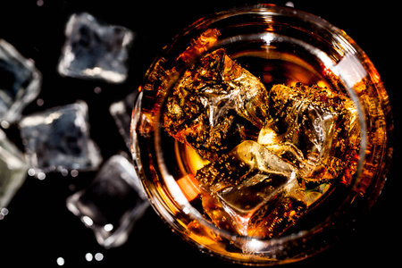 glass of whiskey with ice top viewの写真素材