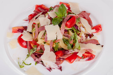 fettuccine with fresh vegetables and baconの写真素材