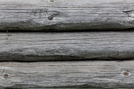 Wooden texture of round logs gray grunge texture. Folk, ethnic, Russian styleの写真素材