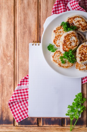 Cutlets on bowl and wooden backgroundの写真素材