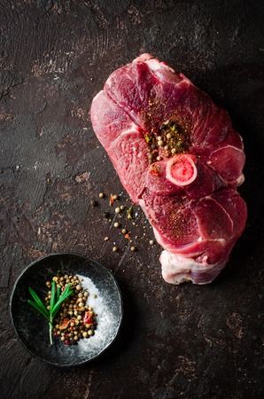 Raw Mutton meat with east spice on dark backgroundの写真素材