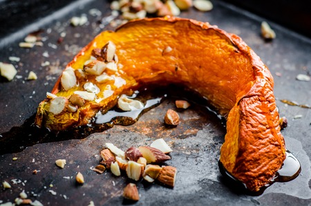 baked pumpkin slices with cinnamon and nuts,healthy dessertの写真素材