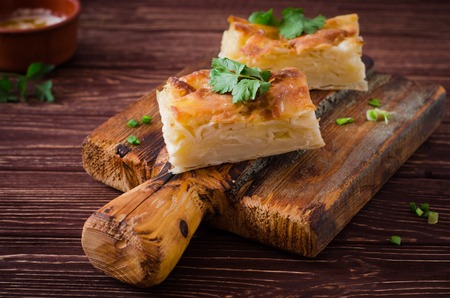 Traditional Georgian cheese layer pie Achma on wooden background. Selective focusの写真素材