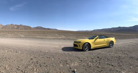 Death Valley National Park, USA. Nov 2017: Yellow Chevrolet Camaro Convertible parked offroadのeditorial素材
