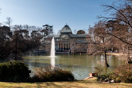 MADRID, SPAIN. JAN 2020: Palacio de Cristal building in front of the lake and fountain in the Parque del Retiro, Madridのeditorial素材