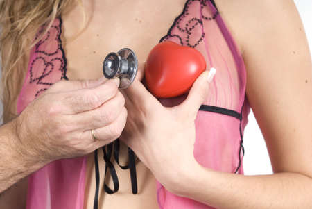 doctor analize a woman with his stethoscopeの写真素材