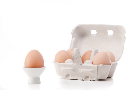 Brown egg in a white cupの写真素材