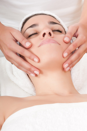beautiful woman in spa center having massageの写真素材