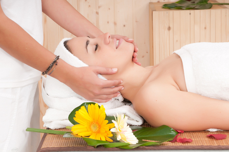 beautiful woman in spa center having massageの写真素材