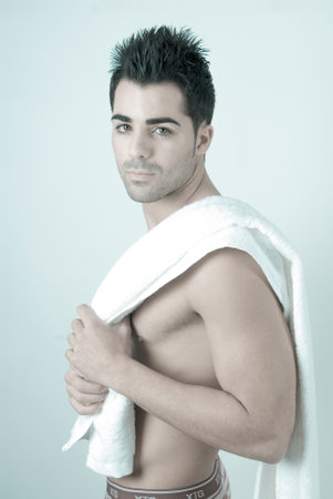 attractive young man in his sweatshirt after a sports sessionの写真素材