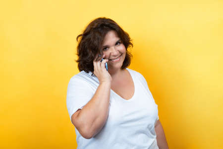 portrait of curvy woman using technology