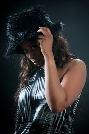 african american woman in close-up photos with hatの写真素材