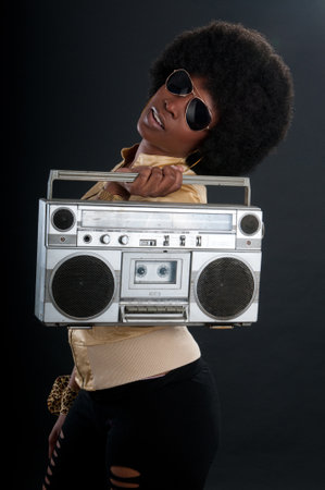 African American soul, jazz or blues singer with a vintage cassette playerの写真素材
