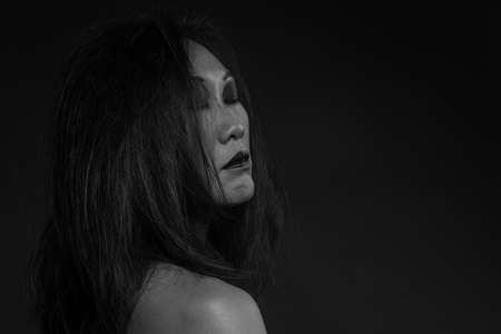 Korean woman portrait profile in dark background