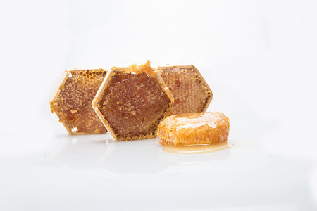 Honeycomb with honey on a white background. Isolated.