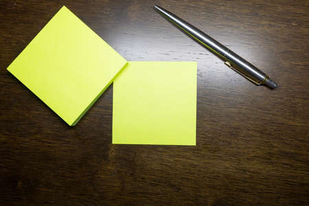 To write something on the notebook or the colorful stick noteの写真素材