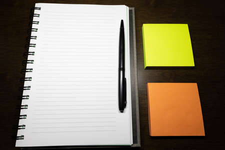 To write something on the notebook or the colorful stick note