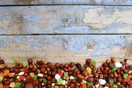 Nuts and dried fruits on a wooden backgroundの写真素材