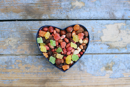 Candies in a heart shaped boxの写真素材