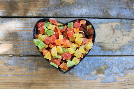 Candies in a heart shaped boxの写真素材