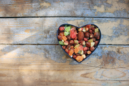 Candies in a heart shaped boxの写真素材