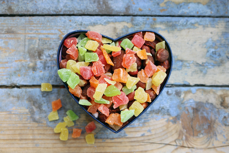 Candies in a heart shaped boxの写真素材