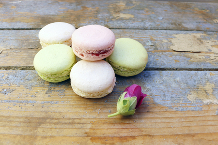 Macaroons on a wooden background, top viewの写真素材
