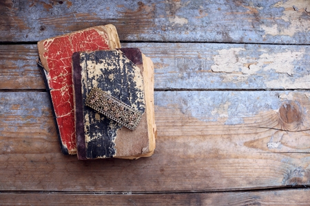 Vintage old books on wooden backgroundの写真素材
