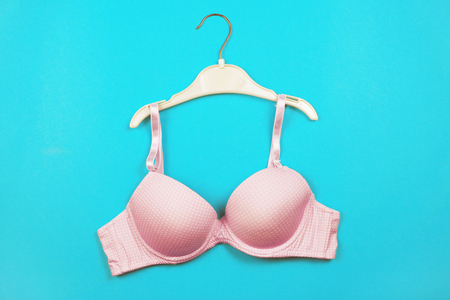 Bra on hanger on blue backgroundの写真素材