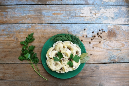 Boiled dumplings on a plate. Wooden rustic backgroundの写真素材