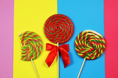 Lollipops on multicolored background, with copy spaceの写真素材