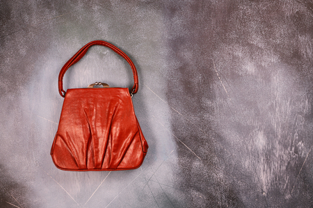 Red leather handbag, retro styled, top viewの写真素材